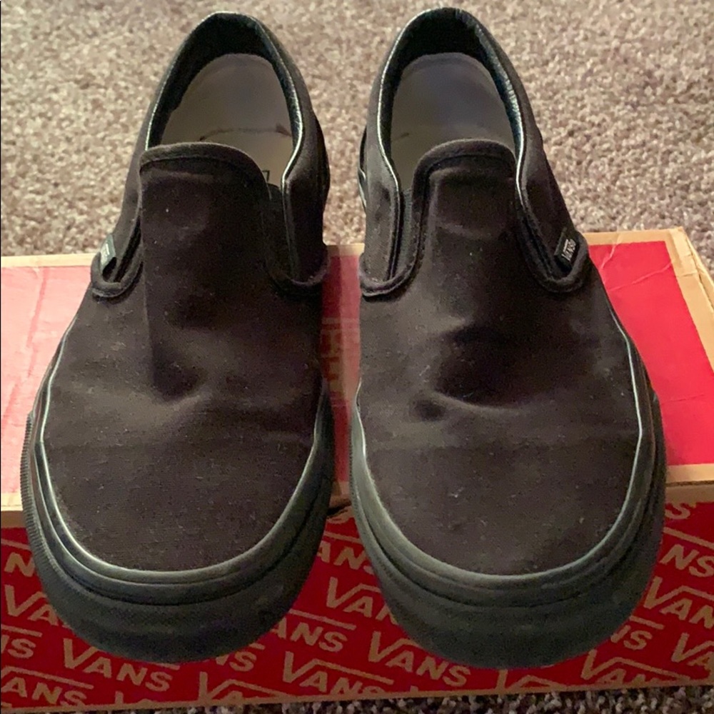 VANSOF THE WALL BLACK SLIP ON VANS